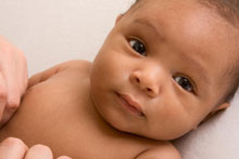 infant looking into camera