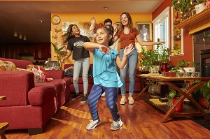 Family dancing in living room