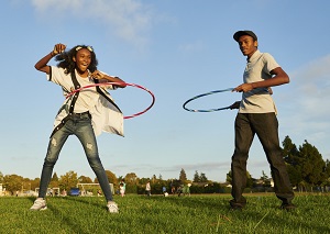 Teen playing with hulahoops
